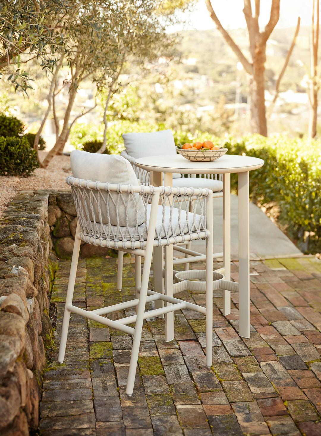 Oscar collection bar table and 2 rope counter stools in white fabric and white finish. Oscar was designed by Ann Marie Vering.